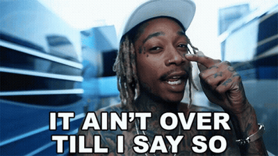 A Man With Dreadlocks Is Pointing At His Nose And Says It Ain T Over Till I Say So GIF