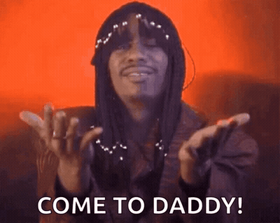 A Man With Dreadlocks Is Saying Come To Daddy With His Hands Outstretched . GIF