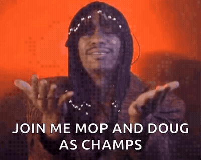 A Man With Dreadlocks Is Saying `` Join Me Mop And Doug As Champs '' With His Hands In The Air . GIF