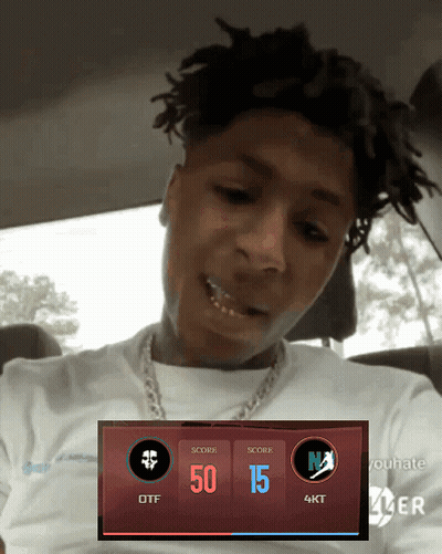 A Man With Dreadlocks Is Sitting In A Car With A Scoreboard Displaying 50 15 And 4Kt GIF