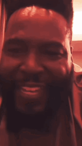 A Man With Dreadlocks Is Smiling With The Word Ladies Above His Head GIF