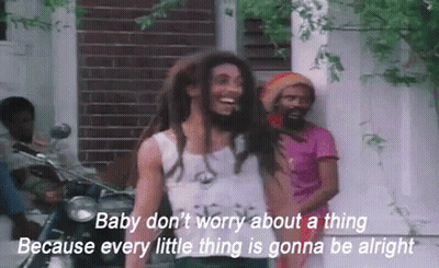 A Man With Dreadlocks Is Standing In Front Of A Motorcycle With The Words Baby Don T Worry GIF
