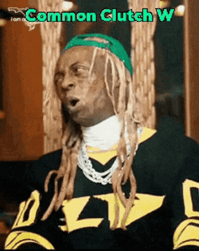 A Man With Dreadlocks Is Wearing A Black And Yellow Jersey With The Word Common Clutch W On It GIF