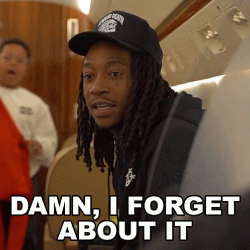 A Man With Dreadlocks Is Wearing A Black Hat And Says " Damn I Forget About It " GIF