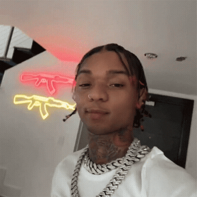 A Man With Dreadlocks Is Wearing A Chain Around His Neck And Taking A Selfie GIF