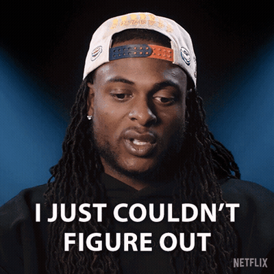 A Man With Dreadlocks Is Wearing A Hat That Says I Just Couldn 'T Figure Out GIF