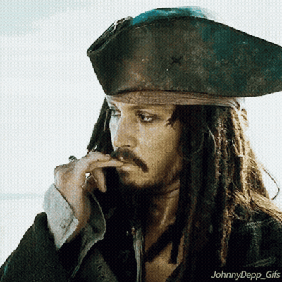 A Man With Dreadlocks Is Wearing A Pirate Hat And Smoking A Cigar GIF