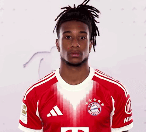 A Man With Dreadlocks Is Wearing A Red And White Adidas Shirt GIF