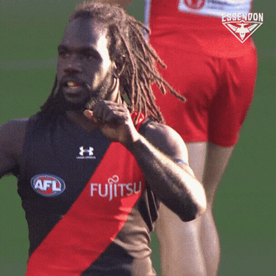 A Man With Dreadlocks Is Wearing A Shirt That Says Fujitsu On It GIF