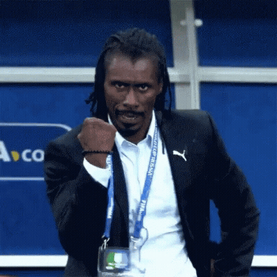 A Man With Dreadlocks Is Wearing A Suit And A Lanyard That Says World Cup Russia . GIF