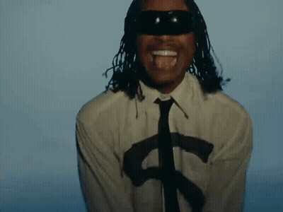 A Man With Dreadlocks Is Wearing A White Shirt And Tie And Sunglasses . GIF