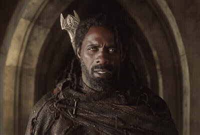 A Man With Dreadlocks Wearing A Crown On His Head GIF