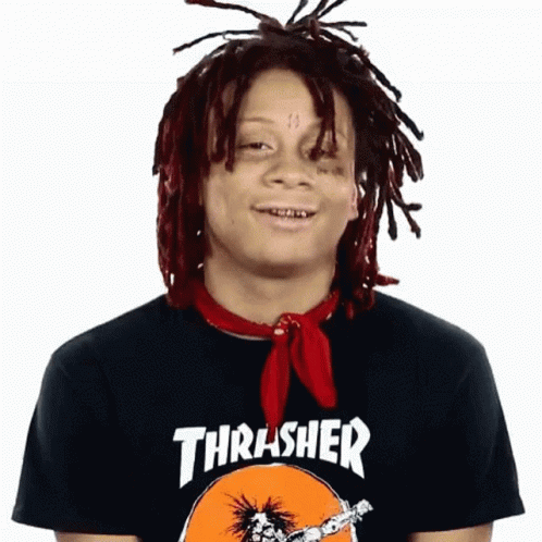 A Man With Dreadlocks Wearing A Thrasher Shirt GIF