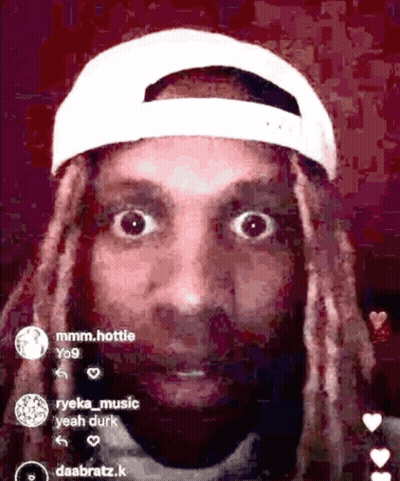 A Man With Dreadlocks Wearing A White Baseball Cap GIF