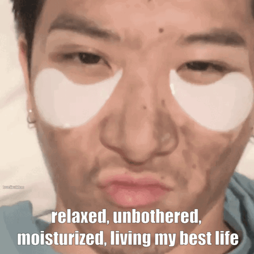 A Man With Eye Patches On His Face Has The Words Relaxed Unbothered Moisturized Living My Best Life Below His Face GIF
