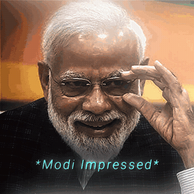 A Man With Glasses And A Beard Has The Words Modi Impressed Written Below Him GIF