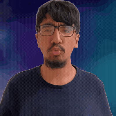 A Man With Glasses And A Beard Holds His Finger To His Lips GIF