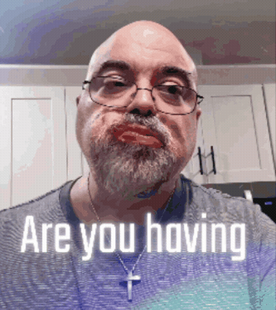 A Man With Glasses And A Beard Is Asking If He Is Having GIF