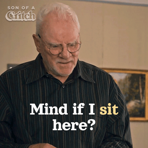 A Man With Glasses And A Beard Is Asking If He Should Mind If I Sit Here GIF