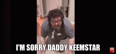 A Man With Glasses And A Beard Is Doing Push Ups In A Bathroom . GIF