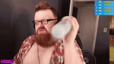 A Man With Glasses And A Beard Is Holding A Bottle In Front Of A Screen That Says Subscribe GIF