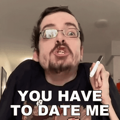 A Man With Glasses And A Beard Is Holding A Marker And Saying " You Have To Date Me " GIF