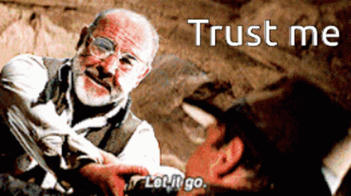 A Man With Glasses And A Beard Is Holding Another Man 'S Hand And Says " Trust Me " GIF