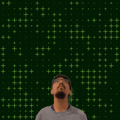A Man With Glasses And A Beard Is Looking Up At The Number 12 GIF