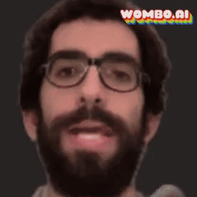 A Man With Glasses And A Beard Is Making A Funny Face With Wombo.ai In The Corner GIF