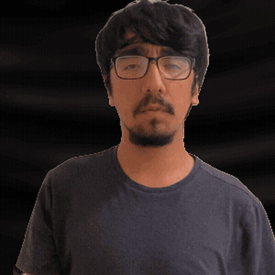 A Man With Glasses And A Beard Is Making A Gesture With His Hand GIF