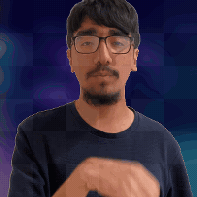 A Man With Glasses And A Beard Is Making A Silly Face GIF