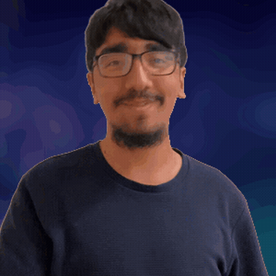 A Man With Glasses And A Beard Is Pointing At Something GIF
