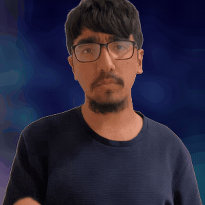 A Man With Glasses And A Beard Is Pointing His Finger GIF