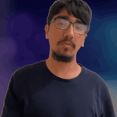 A Man With Glasses And A Beard Is Pointing His Finger At The Camera GIF
