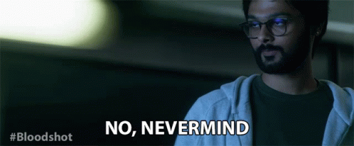 A Man With Glasses And A Beard Is Saying No Nevermind GIF