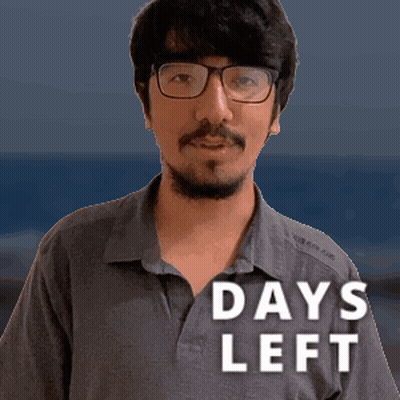 A Man With Glasses And A Beard Is Standing In Front Of A Sign That Says 14 Days Left GIF