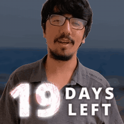 A Man With Glasses And A Beard Is Standing In Front Of A Sign That Says 19 Days Left GIF