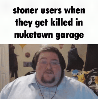 a man with glasses and a beard is standing in front of a sign that says stoner users