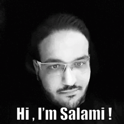 A Man With Glasses And A Beard Is Talking In A Black And White Photo . GIF