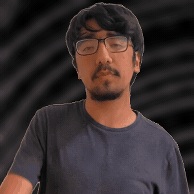 A Man With Glasses And A Beard Is Wearing A Blue T-Shirt GIF