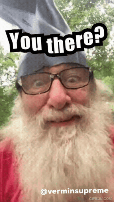 A Man With Glasses And A Beard Is Wearing A Hat That Says You There GIF