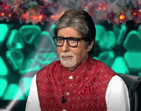 A Man With Glasses And A Beard Is Wearing A Red Vest And A White Shirt GIF