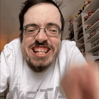 A Man With Glasses And A Beard Is Wearing A Shirt That Says Meta GIF