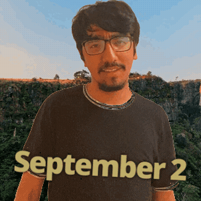 A Man With Glasses And A Beard Is Wearing A Shirt That Says September 2 GIF