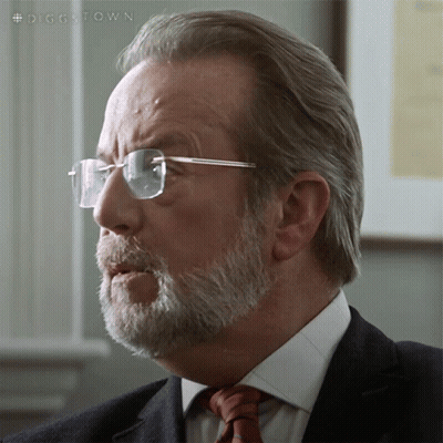 A Man With Glasses And A Beard Is Wearing A Suit And Tie With The Hashtag #Diggstown GIF