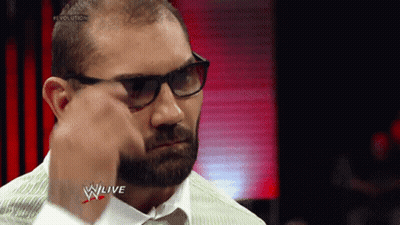 A Man With Glasses And A Beard Is Wearing A White Shirt And Tie GIF
