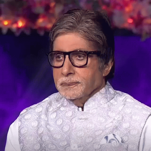 A Man With Glasses And A Beard Is Wearing A White Vest With Flowers On It GIF