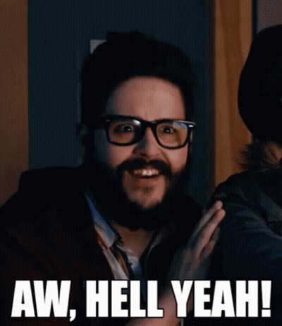 A Man With Glasses And A Beard Says Aw Hell Yeah ! GIF