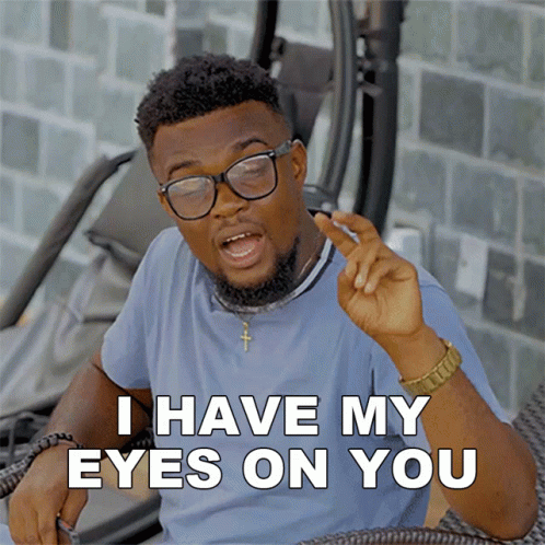 A Man With Glasses And A Beard Says I Have My Eyes On You GIF