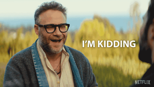 A Man With Glasses And A Beard Says I 'M Kidding In A Netflix Ad GIF